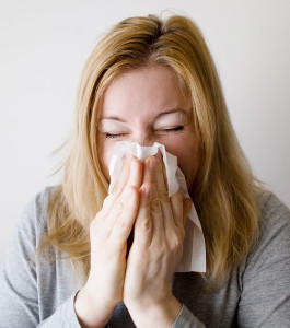 woman blowing nose